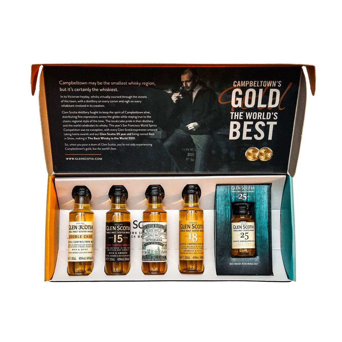 An open box featuring the Glen Scotia Whisky Tasting Gift Set, which includes five different bottles of Glen Scotia scotch. There are four small bottles labeled 10, 15, 16, and 18 years, alongside one larger rectangular bottle labeled 25 years. Above the bottles is a pamphlet highlighting Campbeltown as a top Single Malt Whisky region.