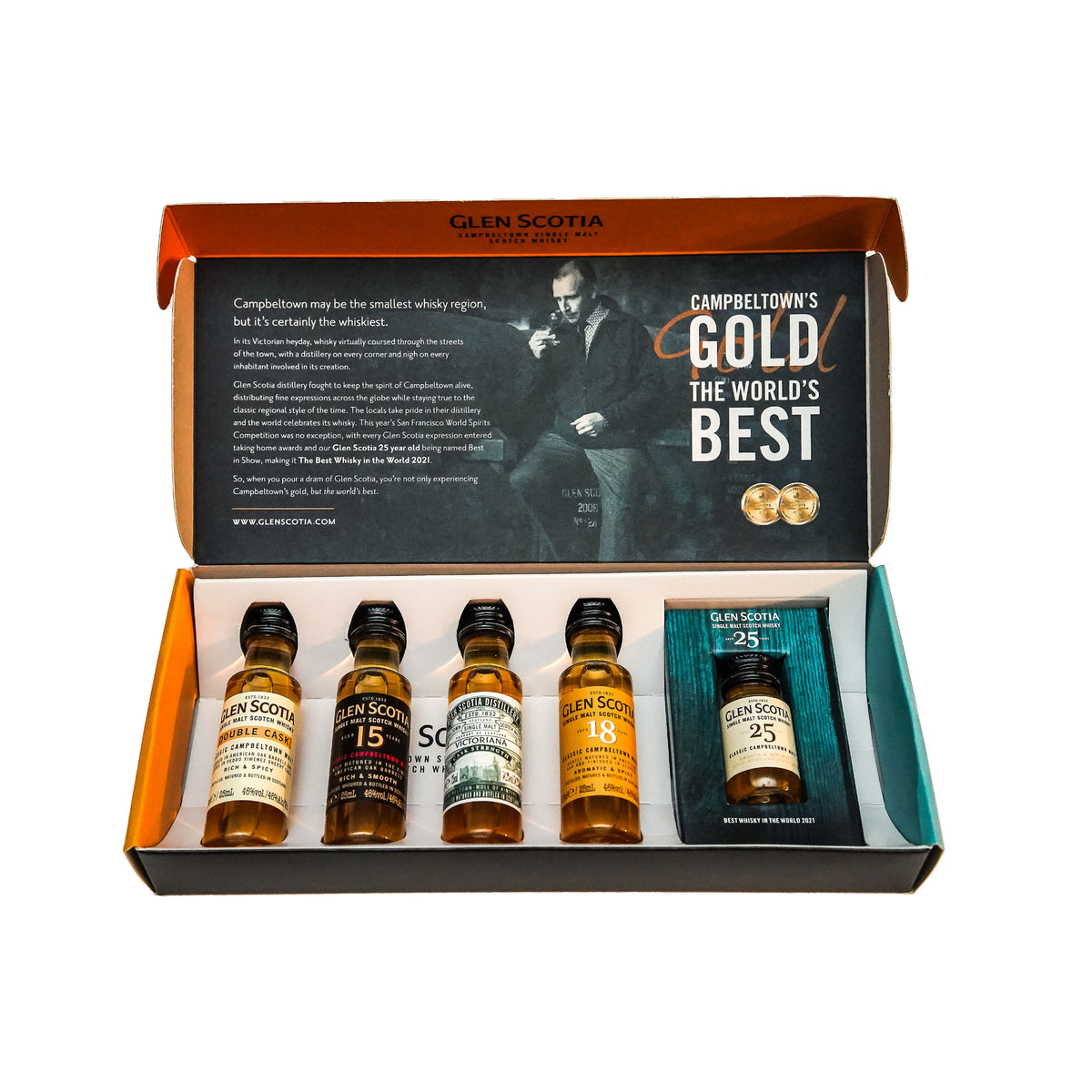 An open box from the Glen Scotia Whisky Tasting Gift Set displays four miniature bottles of Glen Scotia single malt whisky. The box lid features text and an image of a person. The bottles are labeled "Glen Scotia Double Cask," "Glen Scotia 15," "Glen Scotia 18," and "Glen Scotia 25," along with a small booklet, making it the perfect whisky gift from Glen Scotia.