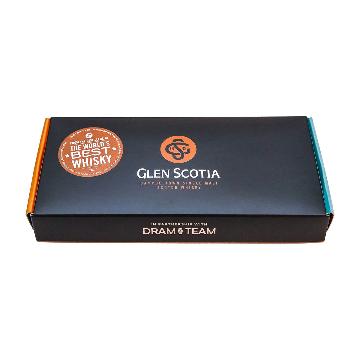A rectangular black box displays the text "Glen Scotia Whisky Tasting Gift Set" alongside a "The World's Best Whisky" badge on the top left. The packaging highlights a partnership with "Dram Team," with its sides featuring orange and light blue colors to emphasize its premium scotch appeal.