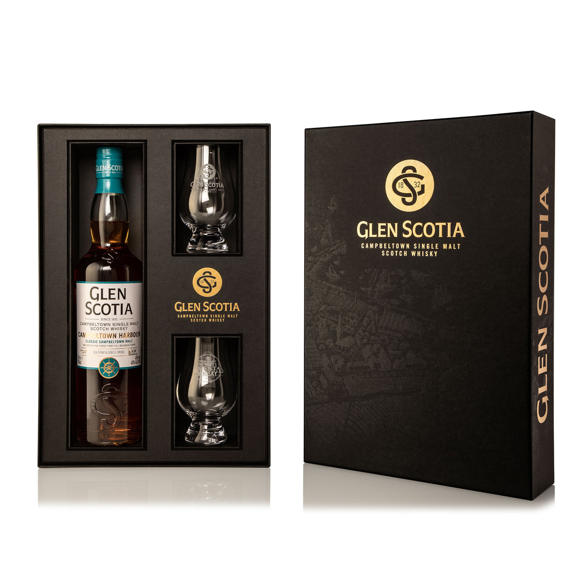 A Glen Scotia Harbour Whisky Gift Set featuring a bottle of Campbeltown single malt Scotch whisky and two branded whisky glasses. Presented in an elegant black box with gold accents and the Glen Scotia logo, the open box beautifully displays its contents.