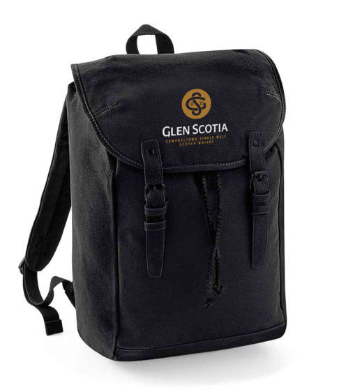 The Glen Scotia Black Backpack features a stylish flap closure secured by two buckle straps. The front of the flap is adorned with the "Glen Scotia" logo in yellow, with "Campbeltown Single Malt Scotch Whisky" written below. Ideal for carrying survival essentials or transporting a bottle on any adventure.