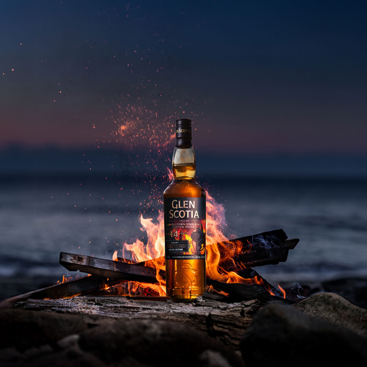 A bottle of Glen Scotia Icons of Campbeltown Release No.2 stands next to its box. The label and box feature a fiery dragon on a dark background, with text reading "Glen Scotia since 1832" and "Campbeltown Single Malt Scotch Whisky Aged 14 Years.