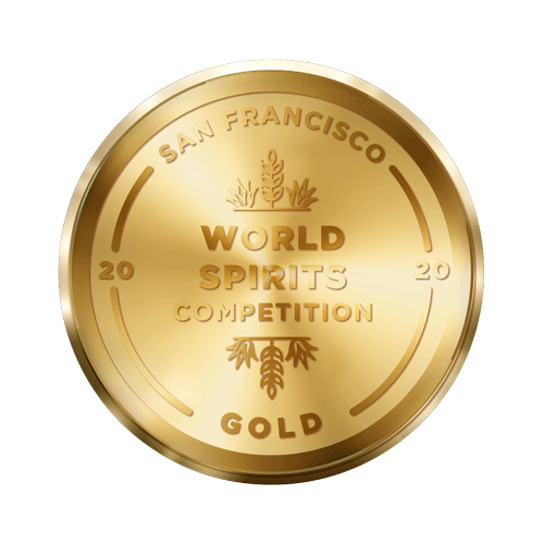 A gold medal with embossed text and decorative elements, awarded by the San Francisco World Spirits Competition in 2020. The words "World Spirits Competition" are prominently displayed in the center, with "San Francisco" and "Gold" along the edges.