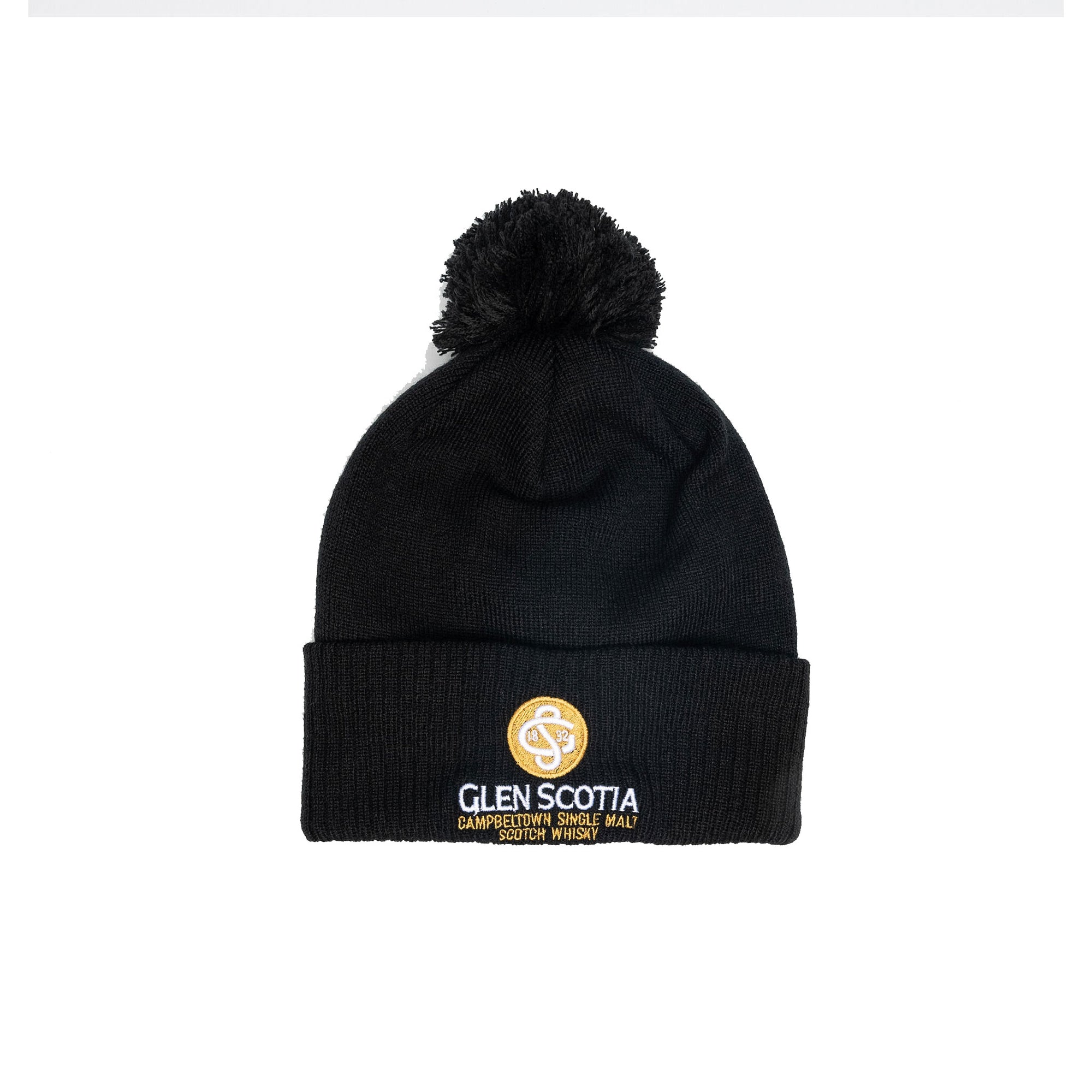 The Glen Scotia Beanie Bobble Hat is a black cold-weather accessory with a pom-pom on top and a folded brim, featuring the Glen Scotia logo embroidered on the brim in gold accents along with "Glen Scotia Campbeltown Single Malt Scotch Whisky.