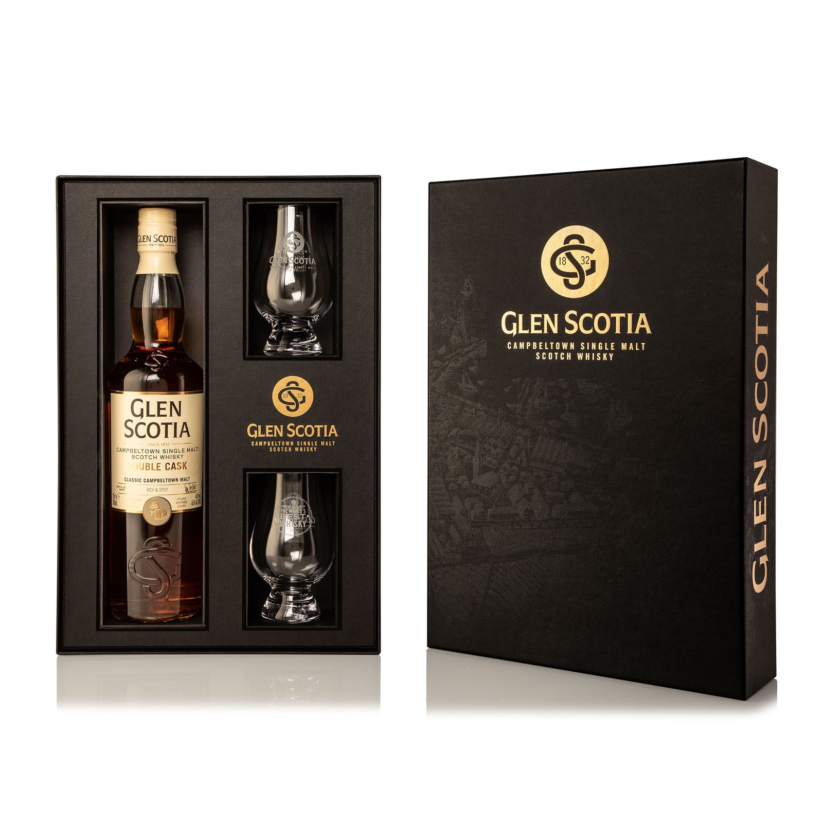 Image shows a bottle of Glen Scotia Double Cask Whisky next to its black and gold packaging. Two branded whisky glasses are placed beside the bottle, completing this elegant Double Cask Whisky Gift Set with glasses. The packaging features an embossed design and the Glen Scotia logo.