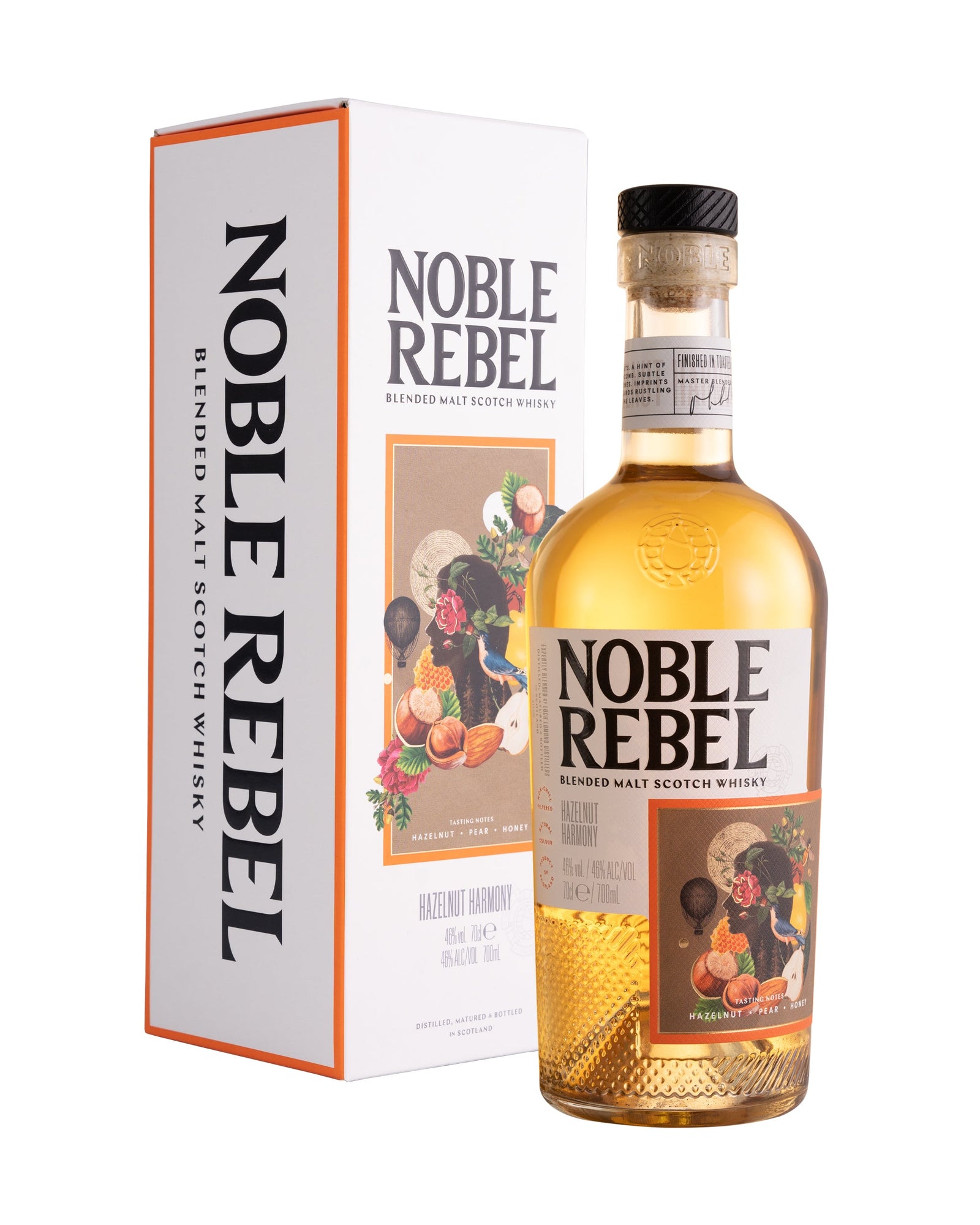 A bottle of Noble Rebel Whisky - Hazelnut Harmony is placed next to its corresponding box. The bottle has a golden whisky inside, with a label featuring colorful artwork. The white box displays "Noble Rebel" along with product details in bold letters, making it an ideal whisky gift for enthusiasts.